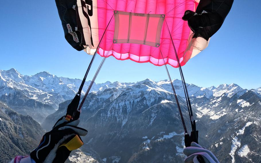 A photo from a sky diver’s point of view looking out over the Swiss Alps 